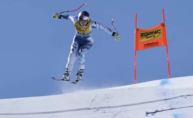 United States' Lindsey Vonn speeds down the course during an alpine ski, women's World Championship downhill training, in Saalbach-Hinterglemm, Austria, Tuesday, Feb. 4, 2025. (AP Photo/Marco Trovati)