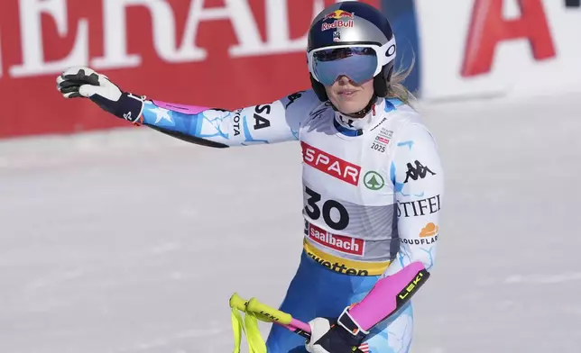 United States' Lindsey Vonn arrives at the finish area after crashing during a women's Super-G, at the Alpine Ski World Championships, in Saalbach-Hinterglemm, Austria, Thursday, Feb. 6, 2025. (AP Photo/Giovanni Auletta)