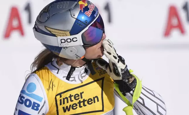 Czech Republic's Ester Ledecka celebrates at the finish area of a women's downhill race, at the Alpine Ski World Championships, in Saalbach-Hinterglemm, Austria, Saturday, Feb. 8, 2025. (AP Photo/Giovanni Auletta)