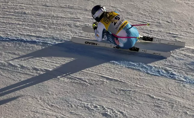 United States' Lindsey Vonn speeds down the course during a women's downhill training, at the Alpine Ski World Championships, in Saalbach-Hinterglemm, Austria, Wednesday, Feb. 5, 2025. (AP Photo/Marco Trovati)