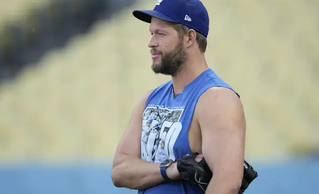 FILE - Los Angeles Dodgers pitcher Clayton Kershaw stands on the field during practice in preparation for Game 1 of a baseball NL Division Series against the San Diego Padres in Los Angeles, Friday, Oct. 4, 2024. (AP Photo/Ashley Landis, File)