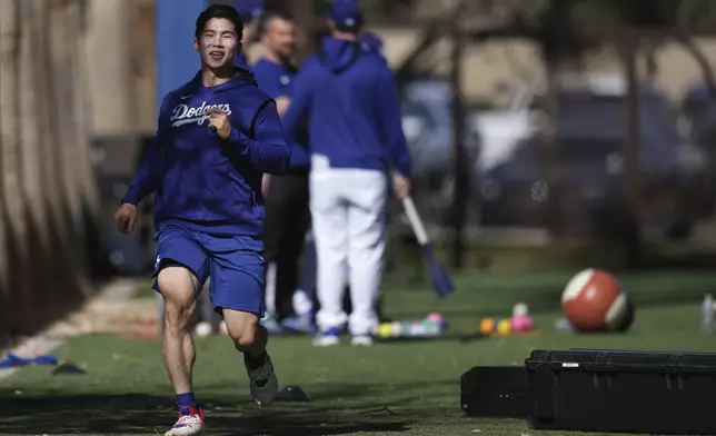 Los Angeles Dodgers' Hyeseong Kim, of South Korea, works out at the Dodgers baseball spring training facility, Tuesday, Feb. 11, 2025, in Phoenix. (AP Photo/Ross D. Franklin)