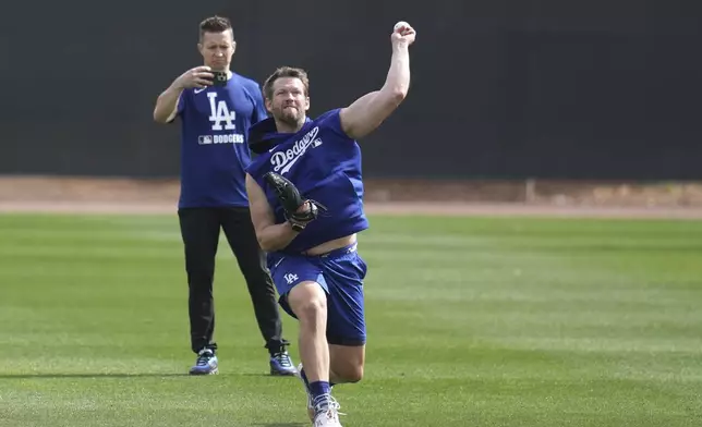 Los Angeles Dodgers pitcher Clayton Kershaw warms up at the Dodgers baseball spring training facility, Tuesday, Feb. 11, 2025, in Phoenix. (AP Photo/Ross D. Franklin)