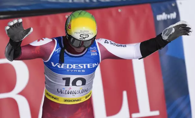Austria's Raphael Haaser celebrates at the finish area of a men's Super-G, at the Alpine Ski World Championships, in Saalbach-Hinterglemm, Austria, Friday, Feb. 7, 2025. (AP Photo/Giovanni Auletta)