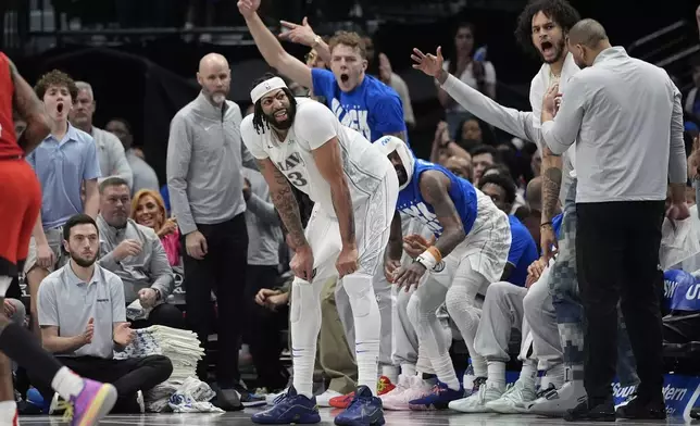 Dallas Mavericks forward Anthony Davis (3) waits for a time out in front of the bench during the third quarter of an NBA basketball game against the Houston Rockets, Saturday, Feb. 8, 2025, in Dallas. (AP Photo/LM Otero)
