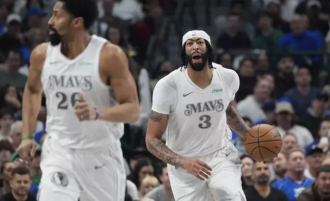 Dallas Mavericks forward Anthony Davis (3) yells to teammate Spencer Dinwiddie (26) during the first half of an NBA basketball game against the Houston Rockets Saturday, Feb. 8, 2025, in Dallas. (AP Photo/LM Otero)