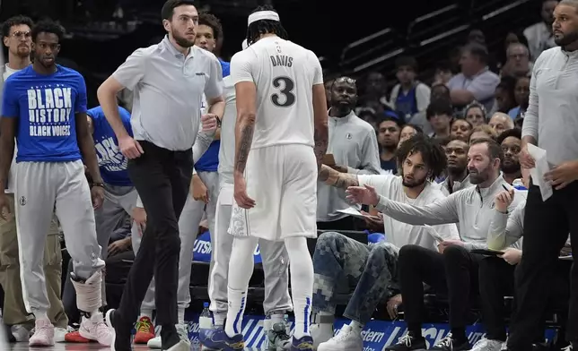 Dallas Mavericks forward Anthony Davis (3) leaves the game during the third quarter of an NBA basketball game against the Dallas Mavericks Saturday, Feb. 8, 2025, in Dallas. (AP Photo/LM Otero)