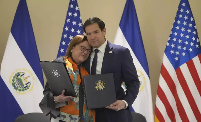 U.S. Secretary of State Marco Rubio, right, and El Salvador's Foreign Minister Alexandra Hill Tinoco pose for a photo after signing a memorandum of understanding regarding civil nuclear cooperation between their countries at the Intercontinental Real Hotel in San Salvador, El Salvador, Monday, Feb. 3, 2025. (AP Photo/Mark Schiefelbein, Pool)