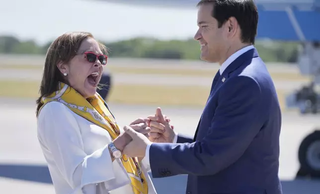 El Salvador's Foreign Minister Alexandra Hill Tinoco, left, welcomes U.S. Secretary of State Marco Rubio upon his arrival to the international airport in San Luis Talpa, El Salvador, Monday, Feb. 3, 2025. (AP Photo/Mark Schiefelbein, Pool)