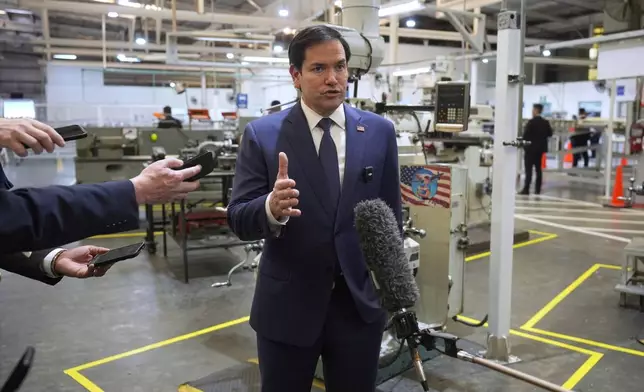 U.S. Secretary of State Marco Rubio speaks to the media during a visit to workshops of aircraft maintenance firm Aeroman in San Luis Talpa, El Salvador, Monday, Feb. 3, 2025. (AP Photo/Mark Schiefelbein, Pool)