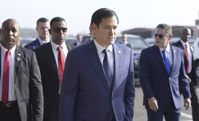 Secretary of State Marco Rubio, with Frank Alexis Abrego, Panama's Minister of Public Security, right, arrives to watch people board a repatriation flight bound for Colombia at Albrook Airport in Panama City, Monday, Feb. 3, 2025. (AP Photo/Mark Schiefelbein, Pool)