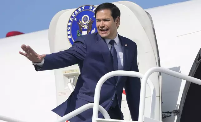 Secretary of State Marco Rubio boards a plane at Panama Pacifico International Airport in Panama City, Monday, Feb. 3, 2025, en route to El Salvador. (AP Photo/Mark Schiefelbein, Pool)