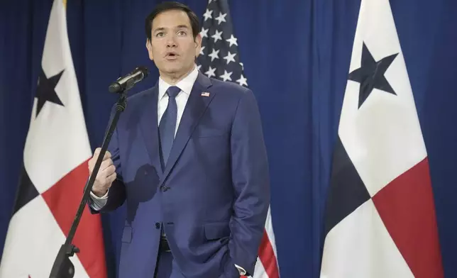 Secretary of State Marco Rubio speaks to reporters after watching people board a repatriation flight bound for Colombia at Albrook Airport in Panama City, Monday, Feb. 3, 2025. (AP Photo/Mark Schiefelbein, Pool)