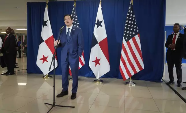 Secretary of State Marco Rubio speaks to reporters after watching people board a repatriation flight bound for Colombia at Albrook Airport in Panama City, Monday, Feb. 3, 2025. (AP Photo/Mark Schiefelbein, Pool)