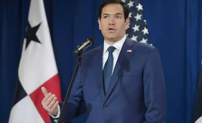 Secretary of State Marco Rubio speaks to reporters after watching people board a repatriation flight bound for Colombia at Albrook Airport in Panama City, Monday, Feb. 3, 2025. (AP Photo/Mark Schiefelbein, Pool)