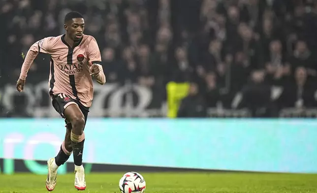PSG's Ousmane Dembele controls the ball during the French League One soccer match between Lyon and Paris Saint-Germain at the Groupama stadium, outside Lyon, France, Sunday, Feb. 23, 2025. (AP Photo/Laurent Cipriani)