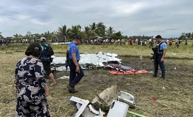 Wreckage of airplane in a rice field in Maguindanao del Sur province, Philippines, after officials say a U.S. military-contracted plane has crashed in a rice field in the southern Philippines, killing all four people on board, on Thursday Feb. 6, 2025. (Sam Mala/UGC via AP)