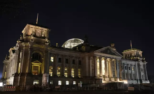 Exterior view of the Reichstag building, home of the German federal parliament, Bundestag, in Berlin, Germany, Sunday, March 23, 2025. (AP Photo/Ebrahim Noroozi)