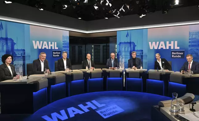 From left, Amira Mohamed Ali, co-leader of the Sahra Wagenknecht Alliance (BSW), Jan van Aken, co-leader of the Left Party (Die Linke), Robert Habeck, Vice Chancellor and member of the Greens, German Chancellor Olaf Scholz, Friedrich Merz, leader of the Christian Democratic Union (CDU), Markus Soeder, leader of the German Christian Social Union, (CSU), Alice Weidel, co-leader of the Alternative for Germany Party (AfD) and Christian Lindner, leader of the Free Democratic Party (FDP), attend a tv discussion after the national election in Berlin, Germany, Sunday, Feb. 23, 2025. (Stefanie Loos/Pool Photo via AP)