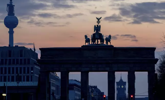 The Brandenburg Gate and the town hall tower, bottom right, are pictured in Berlin, Germany, Sunday, Feb. 23, 2025. (AP Photo/Michael Probst)