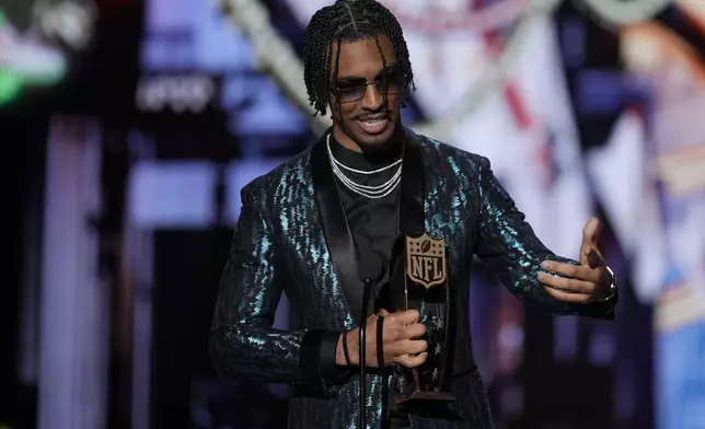 Washington Commanders' Jayden Daniels, AP Offensive rookie of the year speaks during the NFL Honors award show ahead of the Super Bowl 59 football game, Thursday, Feb. 6, 2025, in New Orleans. (AP Photo/David J. Phillip)