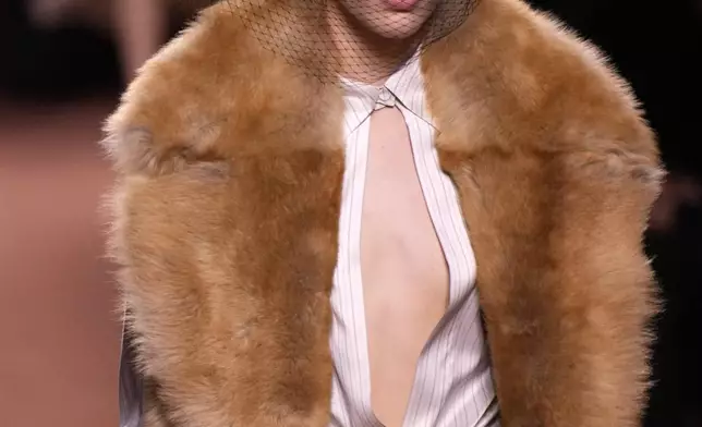 A model wears a creation of the Fendi Fall/Winter 2025-2026 women's collection presented in Milan, Italy, Wednesday, Feb. 26, 2025. (AP Photo/Luca Bruno)