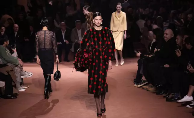 Models wear creations of the Fendi Fall/Winter 2025-2026 women's collection presented in Milan, Italy, Wednesday, Feb. 26, 2025. (AP Photo/Luca Bruno)