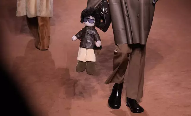 A model wears a creation of the Fendi Fall/Winter 2025-2026 women's collection presented in Milan, Italy, Wednesday, Feb. 26, 2025. (AP Photo/Luca Bruno)