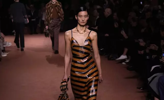 A model wears a creation of the Fendi Fall/Winter 2025-2026 women's collection presented in Milan, Italy, Wednesday, Feb. 26, 2025. (AP Photo/Luca Bruno)