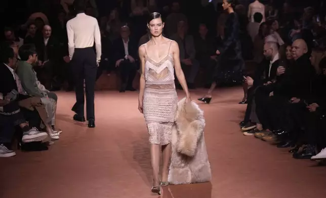 A model wears a creation of the Fendi Fall/Winter 2025-2026 women's collection presented in Milan, Italy, Wednesday, Feb. 26, 2025. (AP Photo/Luca Bruno)