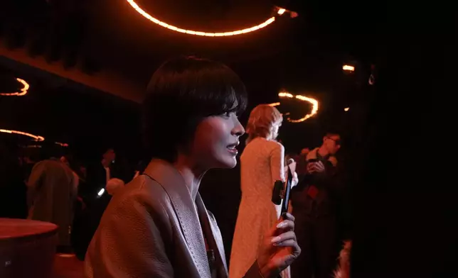 South Korean actress Song Hye-kyo waits for the start of the Fendi Fall/Winter 2025-2026 women's collection in Milan, Italy, Wednesday, Feb. 26, 2025. (AP Photo/Luca Bruno)