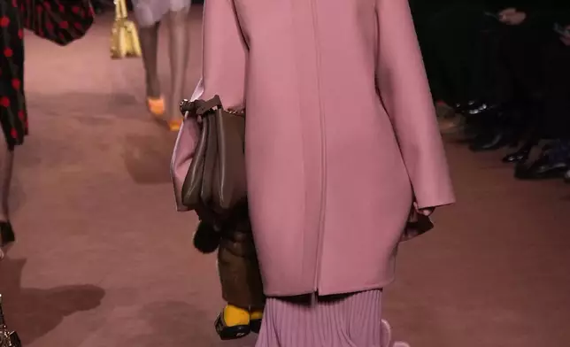 A model wears a creation of the Fendi Fall/Winter 2025-2026 women's collection presented in Milan, Italy, Wednesday, Feb. 26, 2025. (AP Photo/Luca Bruno)