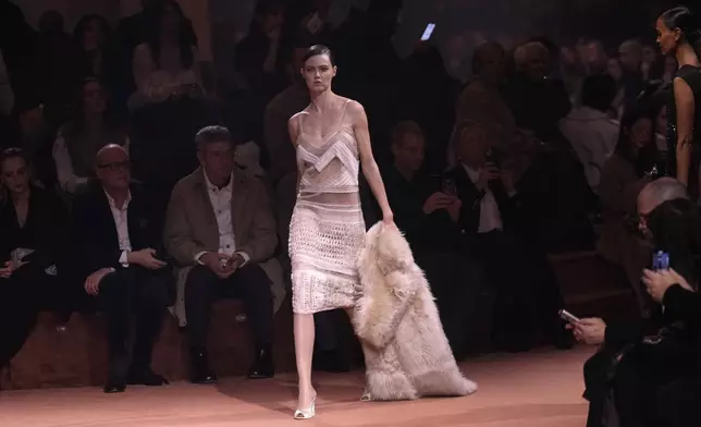 A model wears a creation of the Fendi Fall/Winter 2025-2026 women's collection presented in Milan, Italy, Wednesday, Feb. 26, 2025. (AP Photo/Luca Bruno)