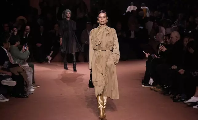 A model wears a creation of the Fendi Fall/Winter 2025-2026 women's collection presented in Milan, Italy, Wednesday, Feb. 26, 2025. (AP Photo/Luca Bruno)