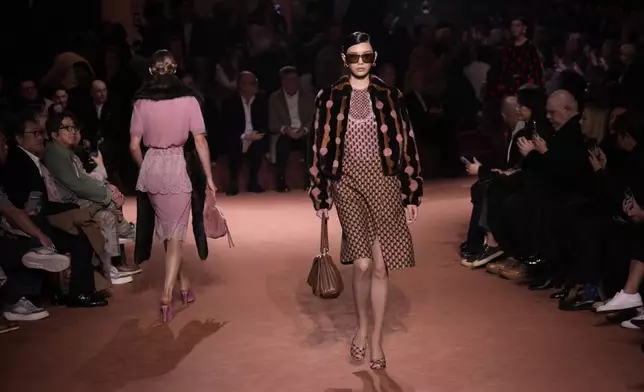 Models wear creations of the Fendi Fall/Winter 2025-2026 women's collection presented in Milan, Italy, Wednesday, Feb. 26, 2025. (AP Photo/Luca Bruno)