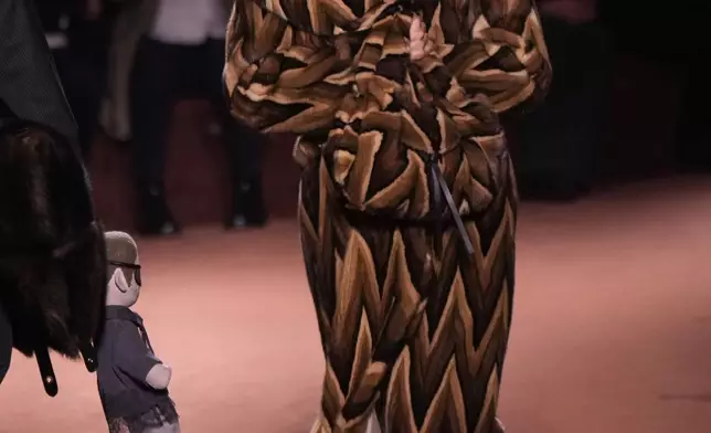 A model wears a creation of the Fendi Fall/Winter 2025-2026 women's collection presented in Milan, Italy, Wednesday, Feb. 26, 2025. (AP Photo/Luca Bruno)