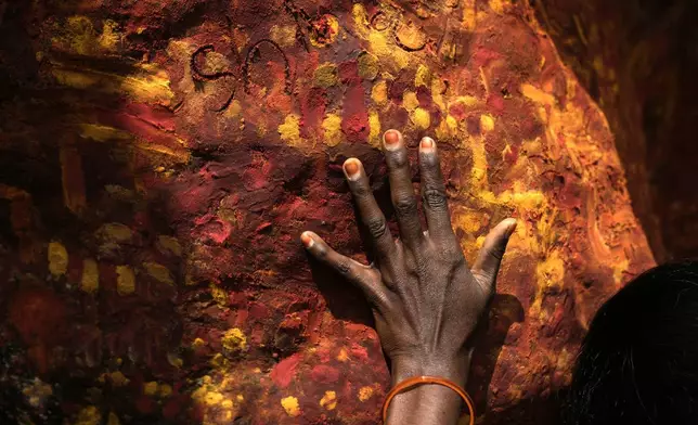 A Hindu devotee offers prayers during Shivaratri festival at Sri Parvathi Jadala Ramalingeshwara Swamy Devastanamu, in Narketpally, India, Wednesday, Feb. 26, 2025. (AP Photo/Mahesh Kumar A.)