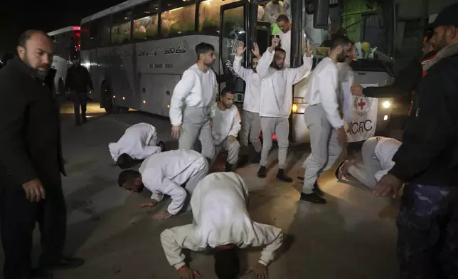 Freed Palestinian prisoners react as they arrive in the Gaza Strip after being released from an Israeli prison following a ceasefire agreement between Hamas and Israel in Khan Younis, Gaza Strip, Thursday, Feb. 27, 2025. (AP Photo/Jehad Alshrafi)