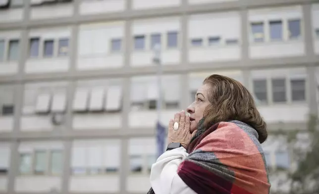 A woman prays at the Agostino Gemelli Polyclinic, in Rome, Monday, Feb. 24, 2025 where Pope Francis is hospitalized since Friday, Feb. 14. (AP Photo/Alessandra Tarantino)