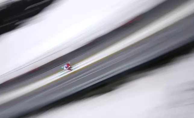 Eva Pinkelnig of Austria in action during her trial jump at the Women Normal Hill HS102 Individual Ski Jumping event at the Nordic World Ski Championships, in Trondheim, Norway, Friday, Feb. 28, 2025. (AP Photo/Matthias Schrader)