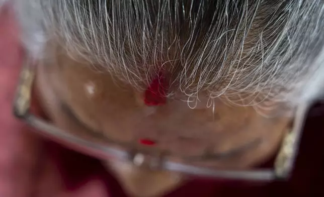 An elderly woman Sushila Gautam, 77, attends a class at the Ujyalo Community learning center in Kathmandu, Nepal, Feb. 3, 2025. (AP Photo/Niranjan Shrestha)