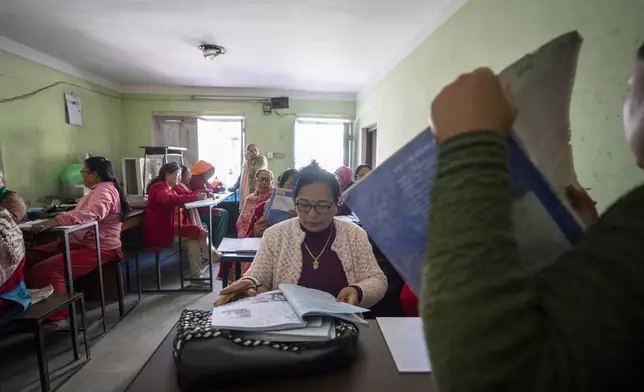 Women attend a class at the Ujyalo Community learning center in Kathmandu, Nepal, Feb. 6, 2025. (AP Photo/Niranjan Shrestha)