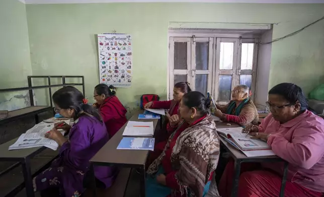 Elderly women attend a class at the Ujyalo Community learning center in Kathmandu, Nepal, Feb. 6, 2025. (AP Photo/Niranjan Shrestha)