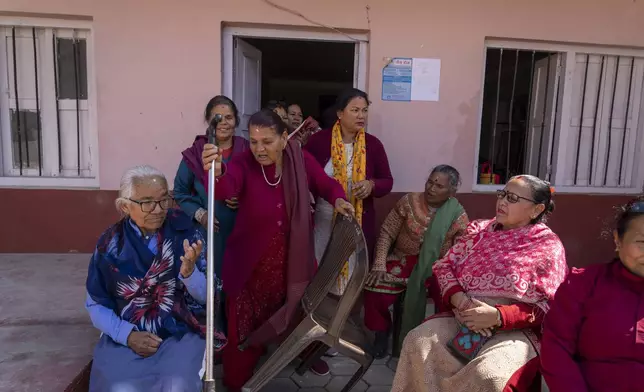 Women leave after attending a class at the Ujyalo Community learning center in Kathmandu, Nepal, Feb. 6, 2025. (AP Photo/Niranjan Shrestha)