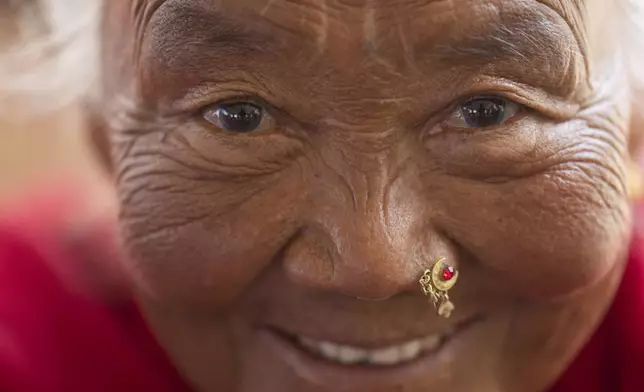 Kanchi Lama, 78, participates in a class at the Ujyalo Community learning center in Kathmandu, Nepal, Feb. 3, 2025. (AP Photo/Niranjan Shrestha)