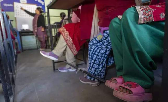 Elderly women attend a class at the Ujyalo Community learning center in Kathmandu, Nepal, Feb. 6, 2025. (AP Photo/Niranjan Shrestha)