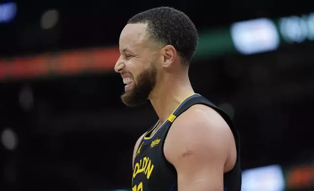 Golden State Warriors guard Stephen Curry reacts to a foul called on him during the first half of an NBA basketball game against the Chicago Bulls, Saturday, Feb. 8, 2025, in Chicago. (AP Photo/Erin Hooley)