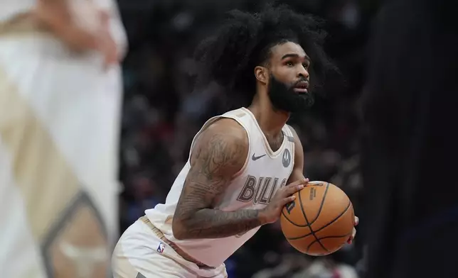 Chicago Bulls guard Coby White prepares to take a free throw during the first half of an NBA basketball game against the Golden State Warriors, Saturday, Feb. 8, 2025, in Chicago. (AP Photo/Erin Hooley)