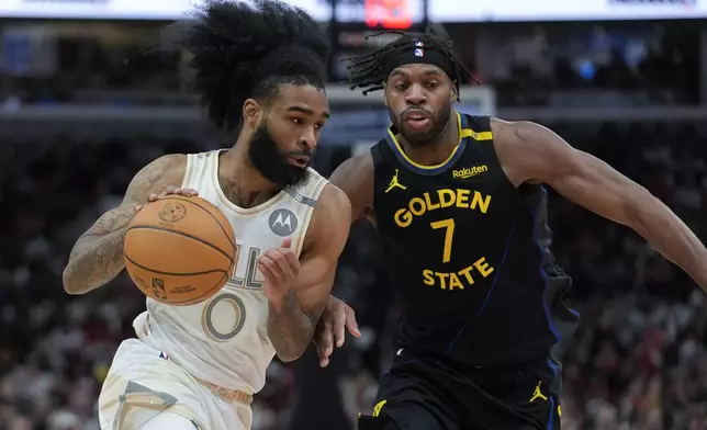 Golden State Warriors guard Buddy Hield (7) guards against Chicago Bulls guard Coby White (0) during the first half of an NBA basketball game Saturday, Feb. 8, 2025, in Chicago. (AP Photo/Erin Hooley)