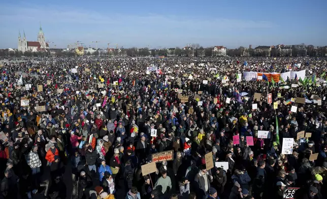People gather to take part in a rally against right-wing extremism, in Munich, Germany, Saturday Feb. 8, 2025. (Sven Hoppe/dpa via AP)